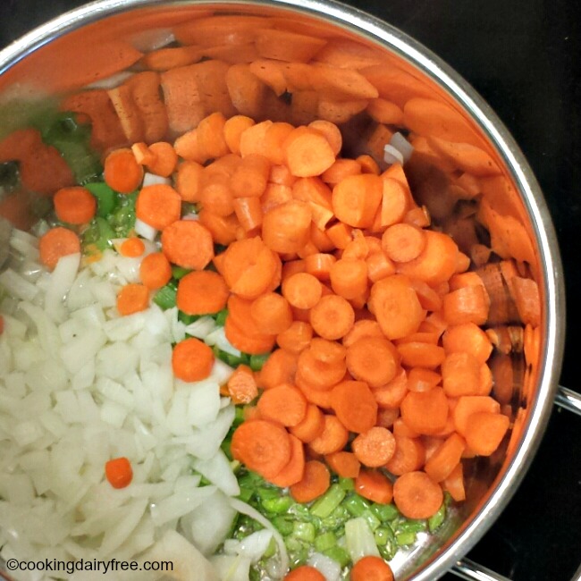 onions, celery, carrots in pot