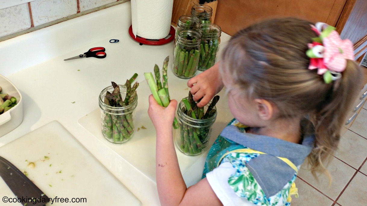 packing the jars with asparagus